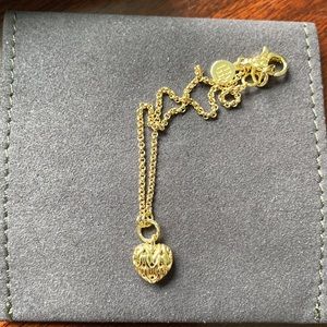 18K gold heart charm bracelet. Never worn or taken out of box minus for pictures